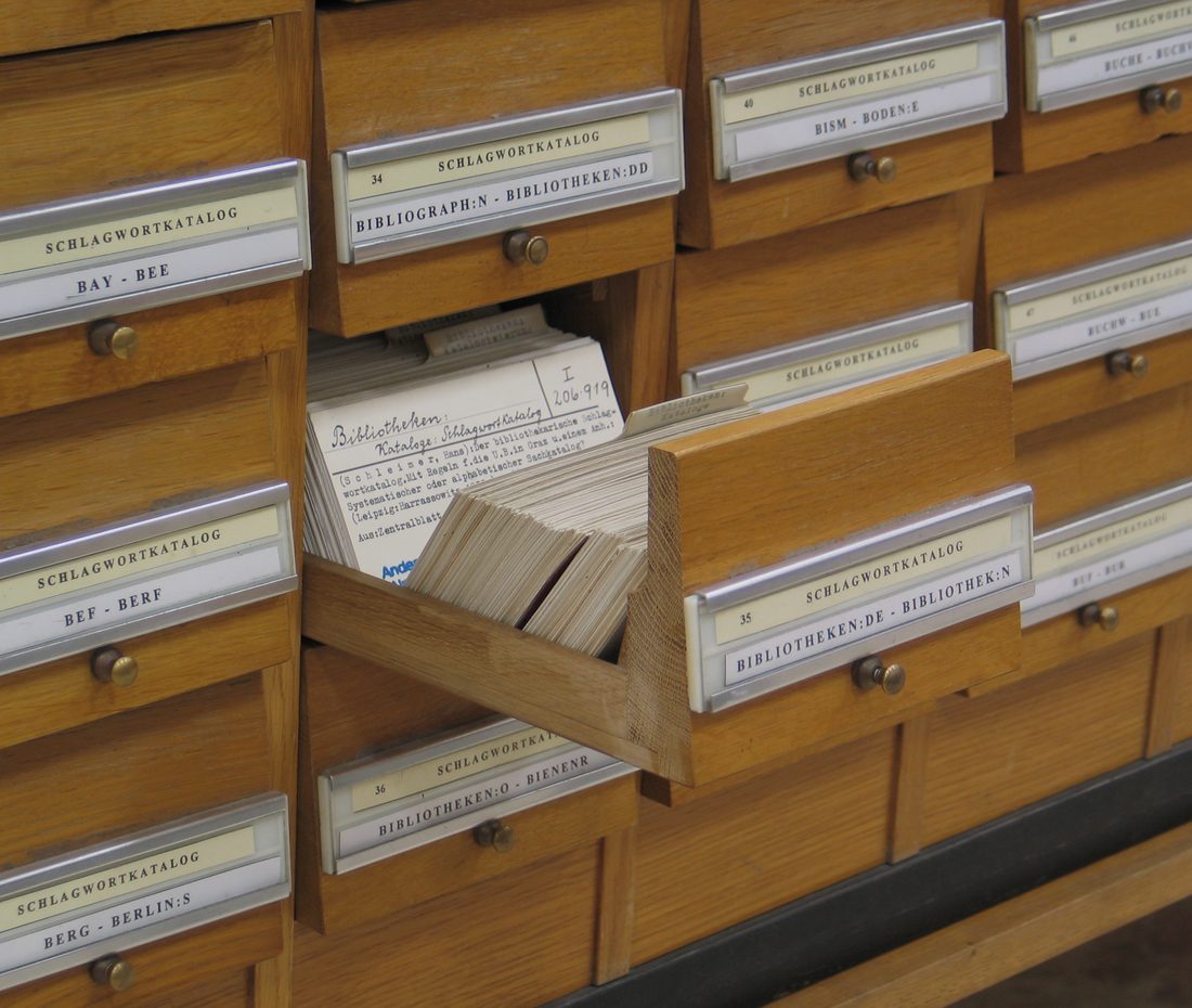 A wall of wooden card-catalogue drawers forming a subject index.